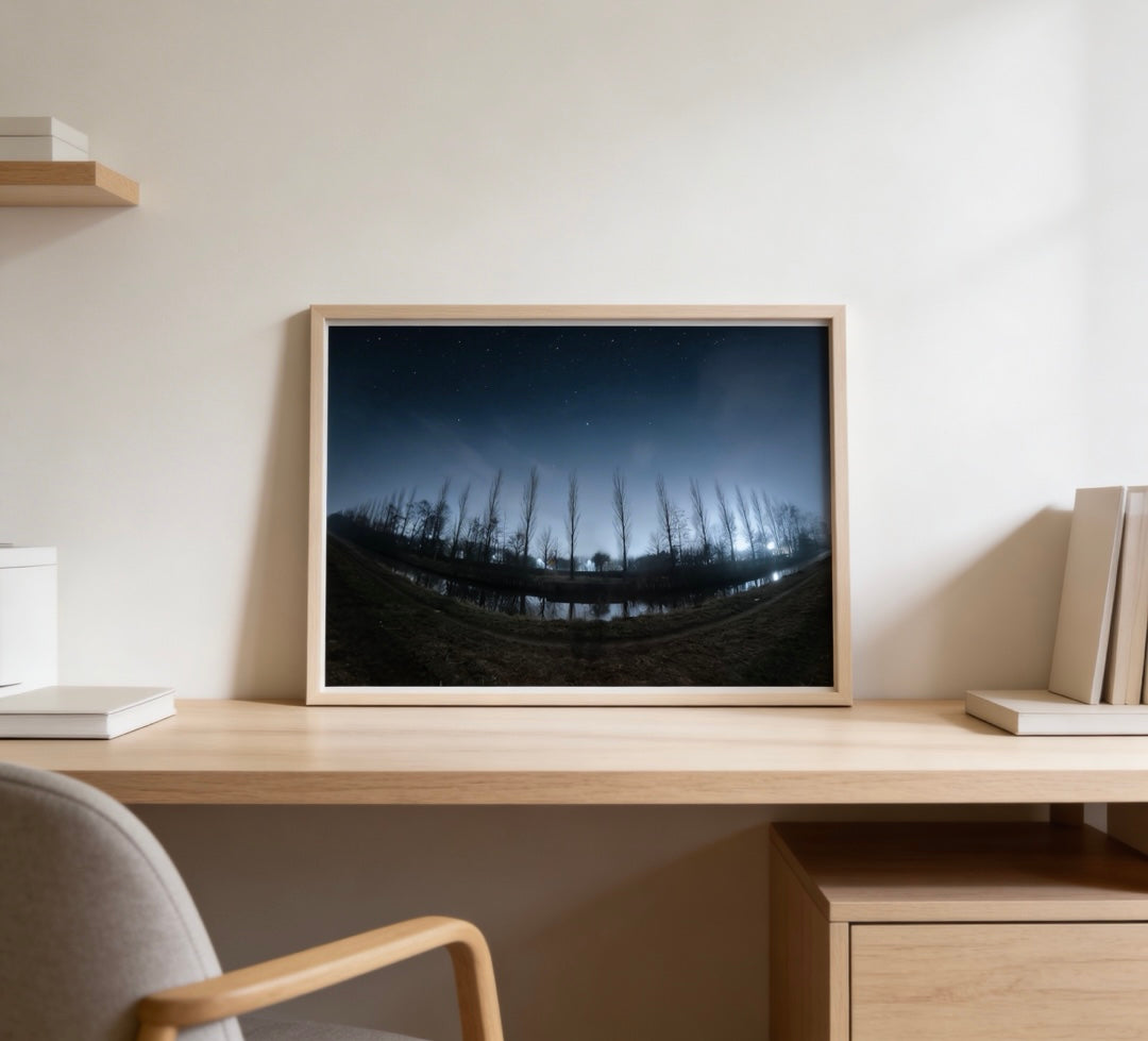 The Shadow Collection — dark Nordic landscape print in wood frame on desk